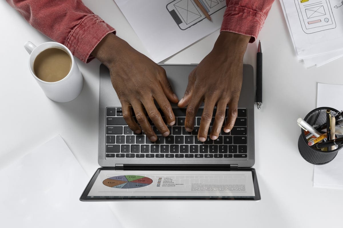 a person typing on a laptop